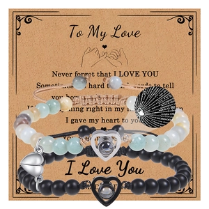 Detail of magnetic heart charms and projection stones on natural stone couple bracelets