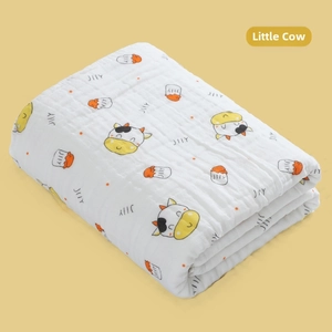 Detail of 6-layer cotton gauze baby blanket with yellow cow and bottle prints