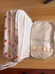 Detail view of large capacity strawberry print corduroy pencil case with interior organizers