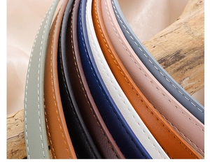 Close-up of colorful PU leather belts with white stitching details for women