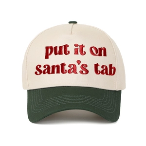 Close-up of red 'put it on santa's tab' embroidery on a two-tone cotton baseball cap
