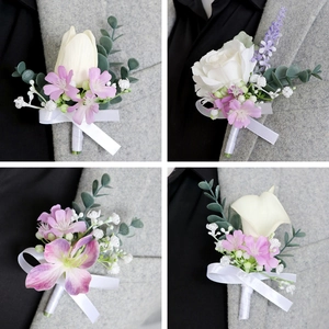 Elegant men's boutonniere set with roses and calla lilies for wedding and formal suits