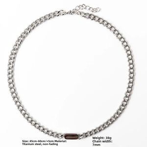 Detail of 7mm silver titanium steel Cuban chain with brown oval pendant and size guide