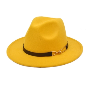 Detail of a bright yellow fedora hat with a black faux leather band and gold buckle