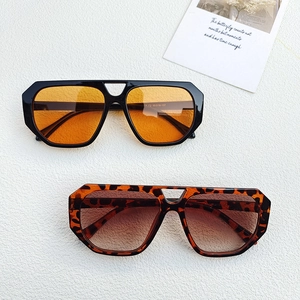 Detail of vintage aviator sunglasses in black and leopard frames with colored lenses