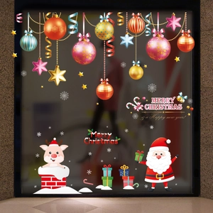 Golden Christmas tree baubles and festive decals for window display decoration