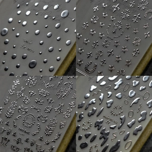 3D chrome silver nail art stickers with gothic stars, baroque patterns, and metallic dots