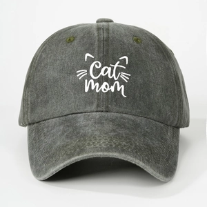 Detailed view of Cat Mom embroidery on a washed dark gray cotton baseball cap