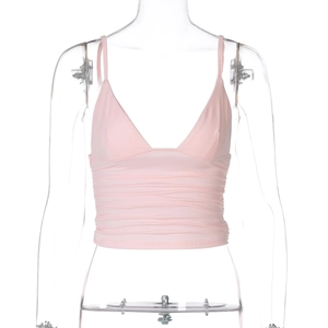 Close-up of pink ruched cropped camisole top featuring soft elastic fabric texture