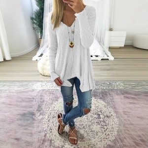Oversized white V-neck knit sweater with irregular hem and ribbed texture for casual wear