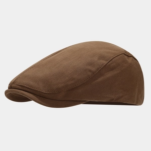Close-up of the dark brown twill cotton fabric and neat stitching on a vintage flat cap