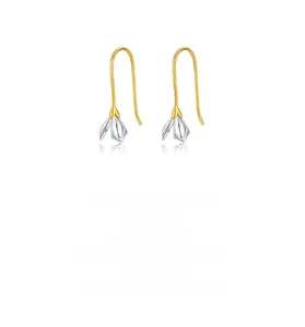 Detailed view of bicolor S925 sterling silver magnolia flower drop earrings with golden stems