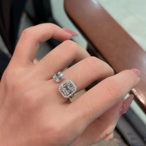 Luxurious silver open ring featuring double square-cut halo crystals on a hand model