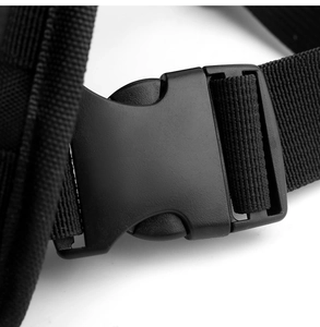 Macro detail of high-quality black nylon webbing and durable plastic buckle on chest bag