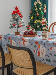 Blue Christmas tablecloth with festive llama and Santa patterns for holiday table setting