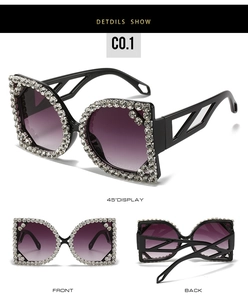 Detailed view of oversized square sunglasses with hand-set rhinestones and purple gradient lens