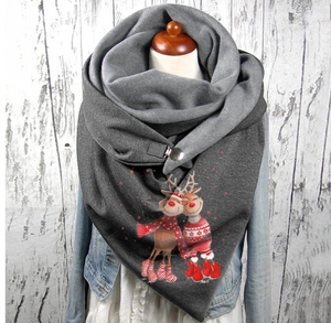 Close-up of grey Christmas scarf with reindeer prints fastened by a silver button