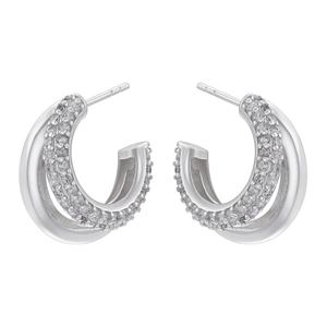 Detailed view of silver C-shaped earrings with double-layered pavé zircons and smooth metal