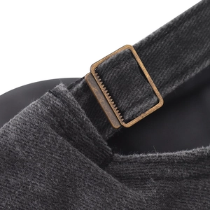 Detail of adjustable bronze buckle and dark grey corduroy strap on baseball cap