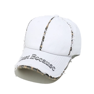 Close-up of white cotton baseball cap with leopard print stripe and Just Because embroidery