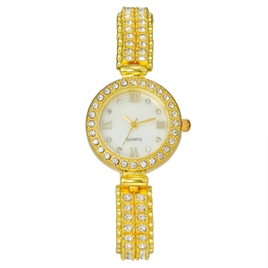 Elegant gold tone women's watch with rhinestone bezel and roman numeral white dial
