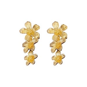 Vintage gold metal triple flower dangle earrings with detailed embossed floral texture