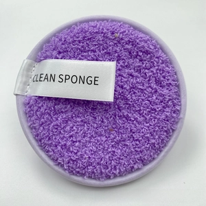 Close-up of purple microfiber makeup sponge with CLEAN SPONGE label and soft texture