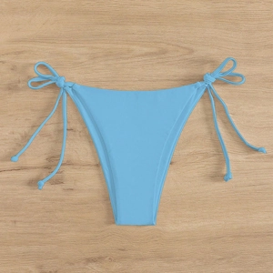 Sky blue string bikini bottom with adjustable side ties on light wood background