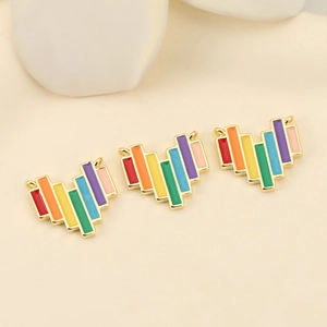 Detailed view of rainbow enamel heart charms with 18K gold plating for DIY jewelry
