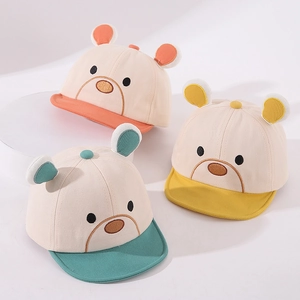 Detailed view of kids cotton baseball caps with bear ears in orange, yellow and teal