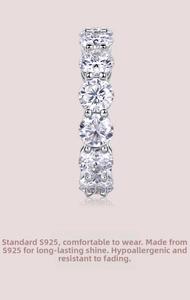 Detailed macro view of S925 sterling silver eternity band with six round moissanite stones