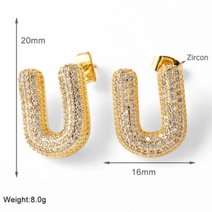 Macro detail showing gold plated U-shaped earrings with zircon pavé setting and size specs