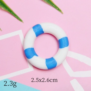 Detailed macro view of a 2.3g resin lifebuoy charm with blue stripes for DIY crafts
