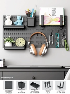 Detail of black modular pegboard set with shelves, hooks and storage bins for wall organization