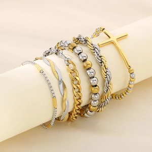 Detail of 5-piece two-tone stainless steel bracelet set with cross pendant
