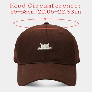 Detail of a brown baseball cap with cat embroidery showing 56-58cm head size measurements