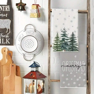 Cozy farmhouse kitchen setup with Merry Christmas tea towels and rustic holiday decor