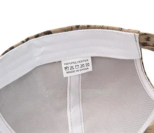 Detail of internal care label on leopard print baseball cap made of 100% polyester