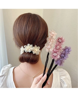 Detail of Korean floral hair bun maker with soft fabric petals and pearl stamen accents