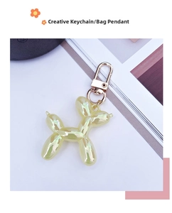 Detail of pearlescent colorful balloon dog keychain with a premium golden spring clasp