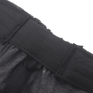 Macro view of dark grey newsboy cap with elastic band and textured cotton fabric