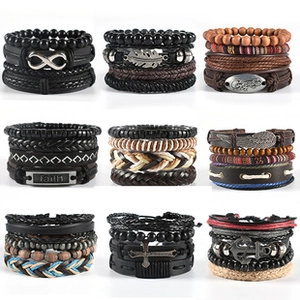 Macro view of multi-layer leather bracelets with wooden beads and engraved metal tags
