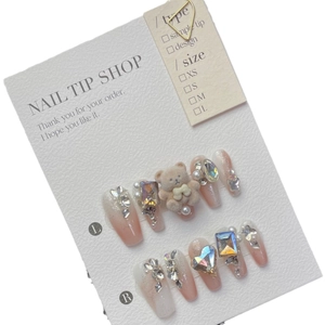 Handmade gradient pink press-on nails with 3D plush bear and sparkling gemstone accents