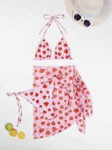 Detailed flat lay of pink strawberry print three-piece bikini with sheer mesh sarong