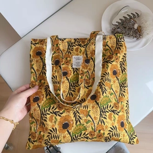 Vintage yellow floral canvas tote bag with artisan block print design and white straps