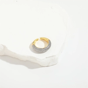 Detailed shot of multi-layer heart ring with micro-pave cubic zirconia on gold band