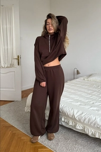 Close-up of chocolate brown sweater set featuring embroidered Nature text and zipper