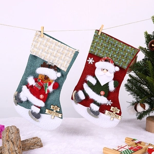 3D cartoon Christmas stockings with Santa and reindeer hanging on a rope decor