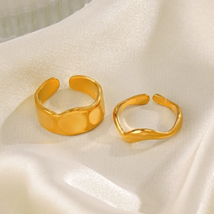 Two-piece set of gold plated stainless steel open rings with dot and wave textures