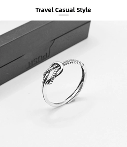 Detailed close-up of retro twist knot silver ring with a vintage oxidized texture
